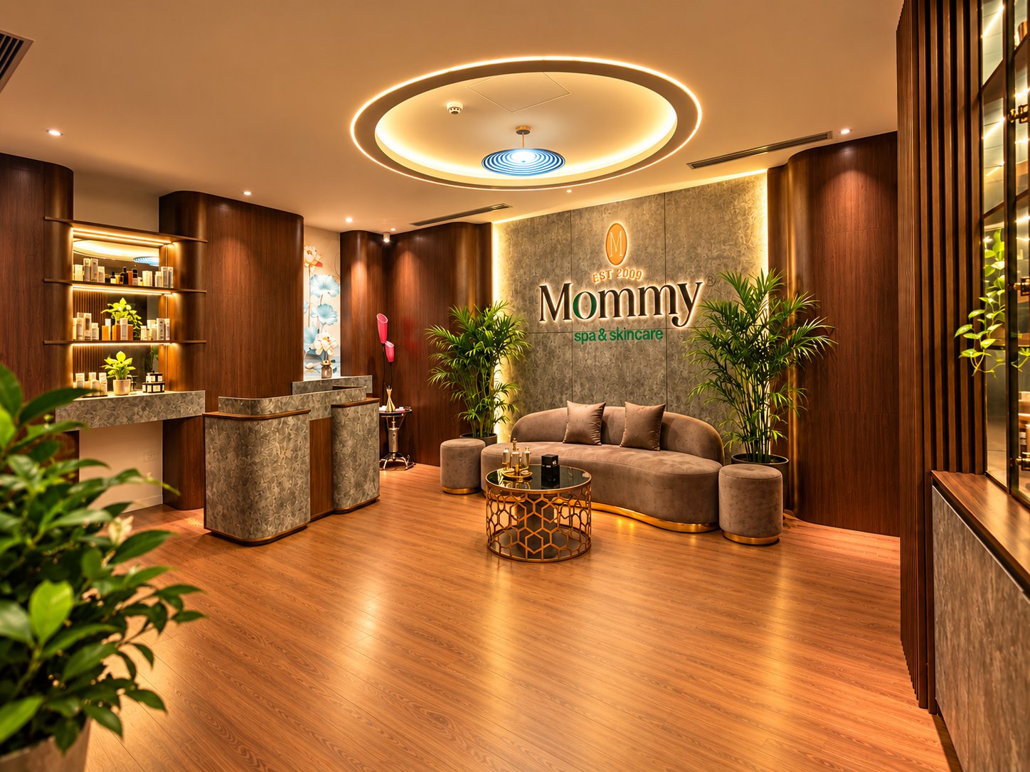 Sảnh đón tiếp Mommy Spa với tường logo và sofa
